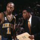 Point guard Jamaal Tinsley #11 of the Indiana Pacers talks to his head coach Isiah Thomas during the NBA game against the New York Knicks at Madison Square Garden in New York City, New York. The Knicks defeated the Pacers 101-99.